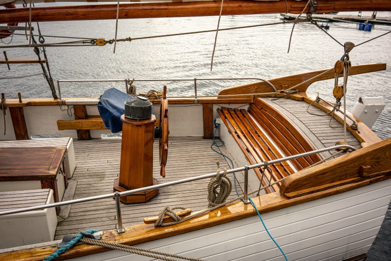 What Should You Use to Protect Teak Flooring on a Nautical Vessel?